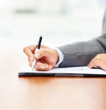 person filling out a business form