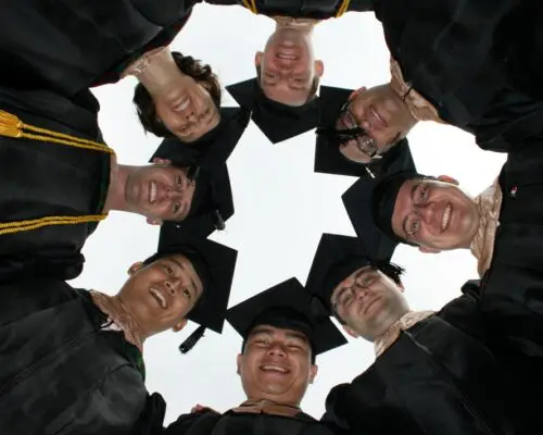 group of graduates in caps and gowns